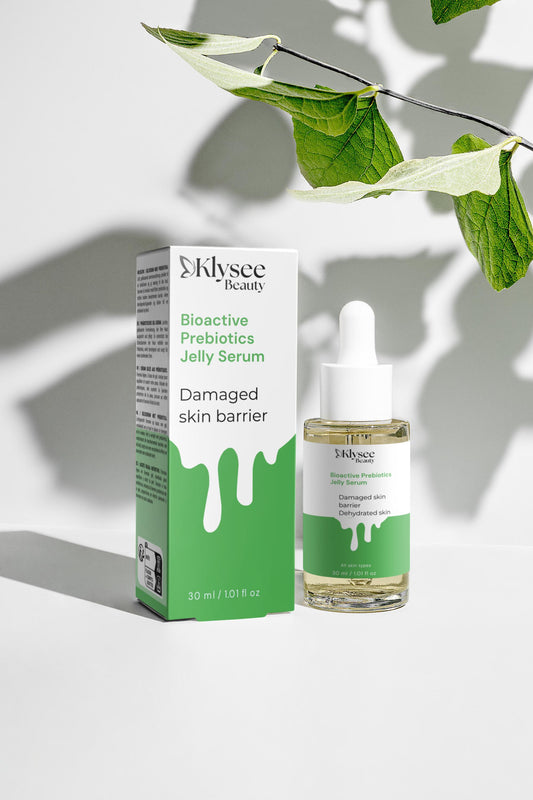 A conceptual image featuring water droplets and microscopic textures representing the skin's microbiome and the protective barrier support provided by prebiotics