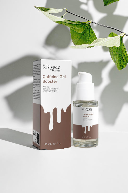 Klysee Caffeine Gel Booster packaging and bottle on a light background with leaves.