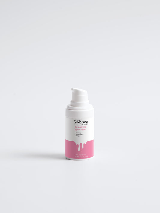 A person gently patting the smoothing eye cream onto the outer corners of their eyes to target fine lines and wrinkles.