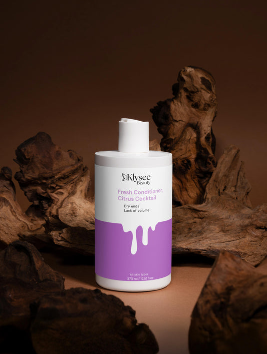 Mlysee Fresh Conditioner Citrus Cocktail bottle with a purple label on a brown background