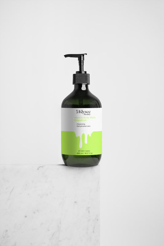 Bottle of shampoo with a green label on a white background