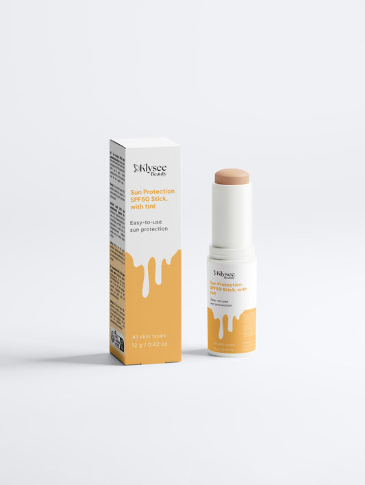 A sleek, white Klysee Sun Protection SPF 50 mineral sunscreen stick stands upright against a clean, minimalist background. The image highlights the portable 12g design and professional branding of this high-performance sun care product.