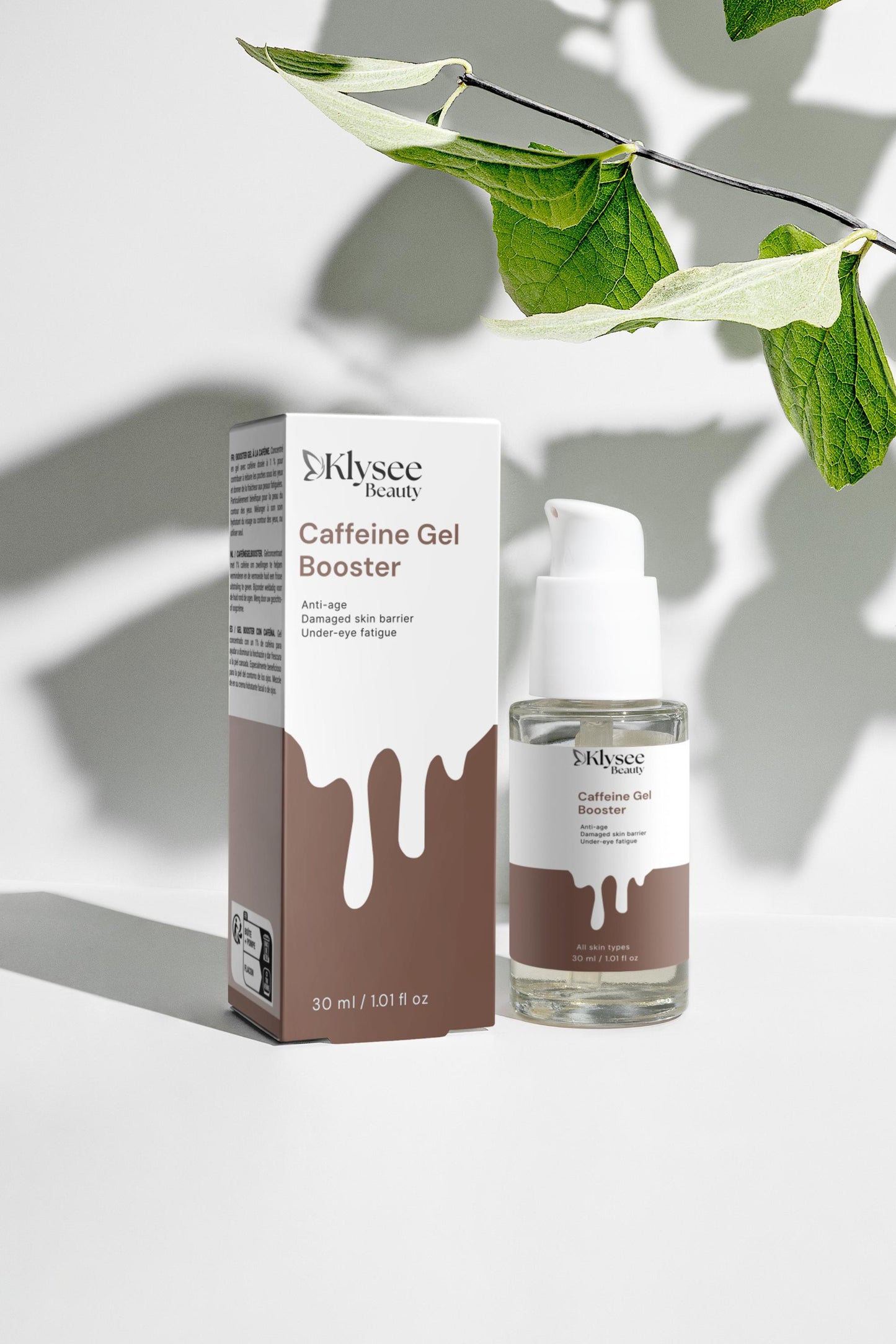 Klysee Caffeine Gel Booster packaging and bottle on a light background with leaves.