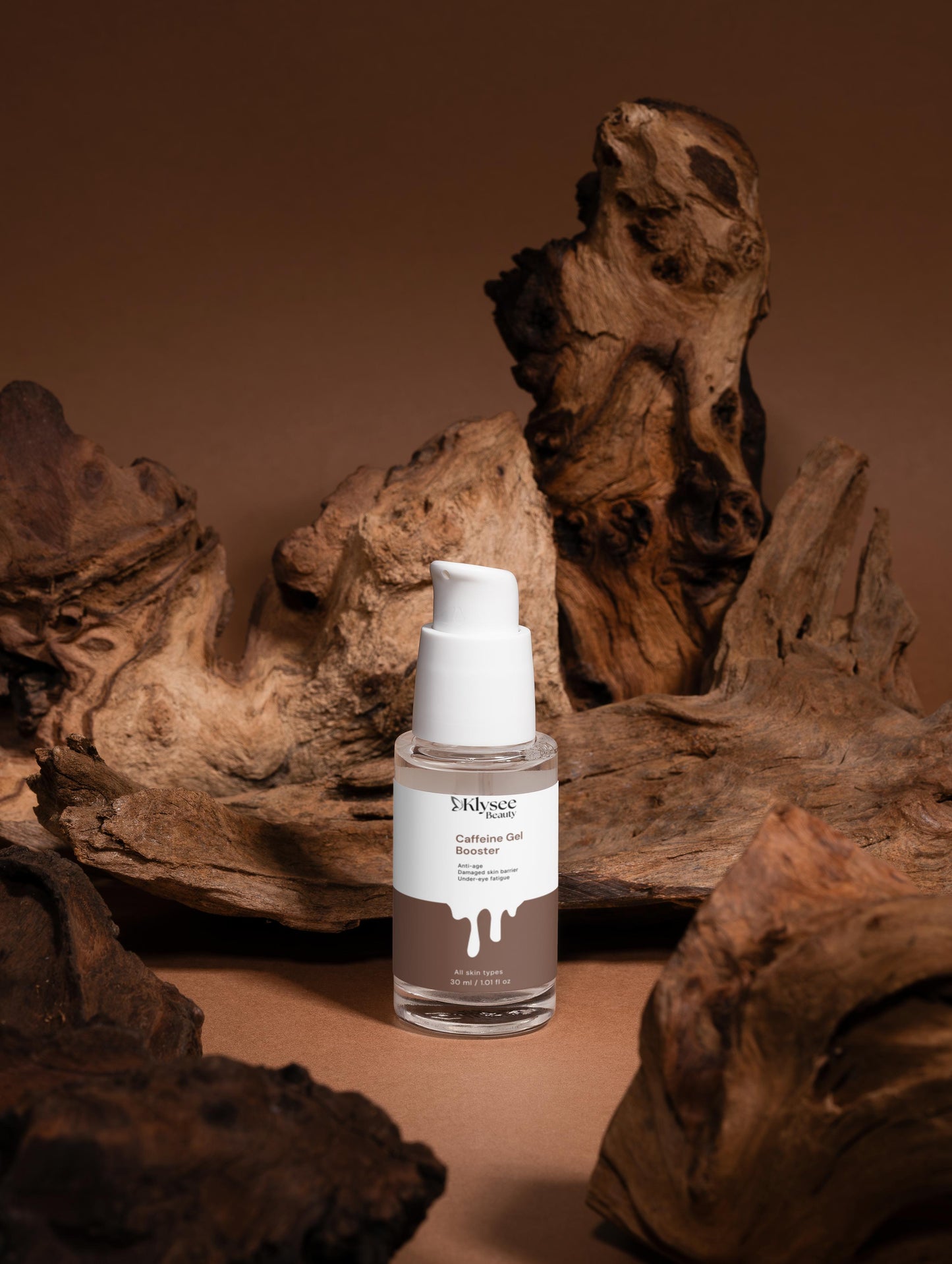 Skincare bottle with a white cap on a brown background with natural wood elements