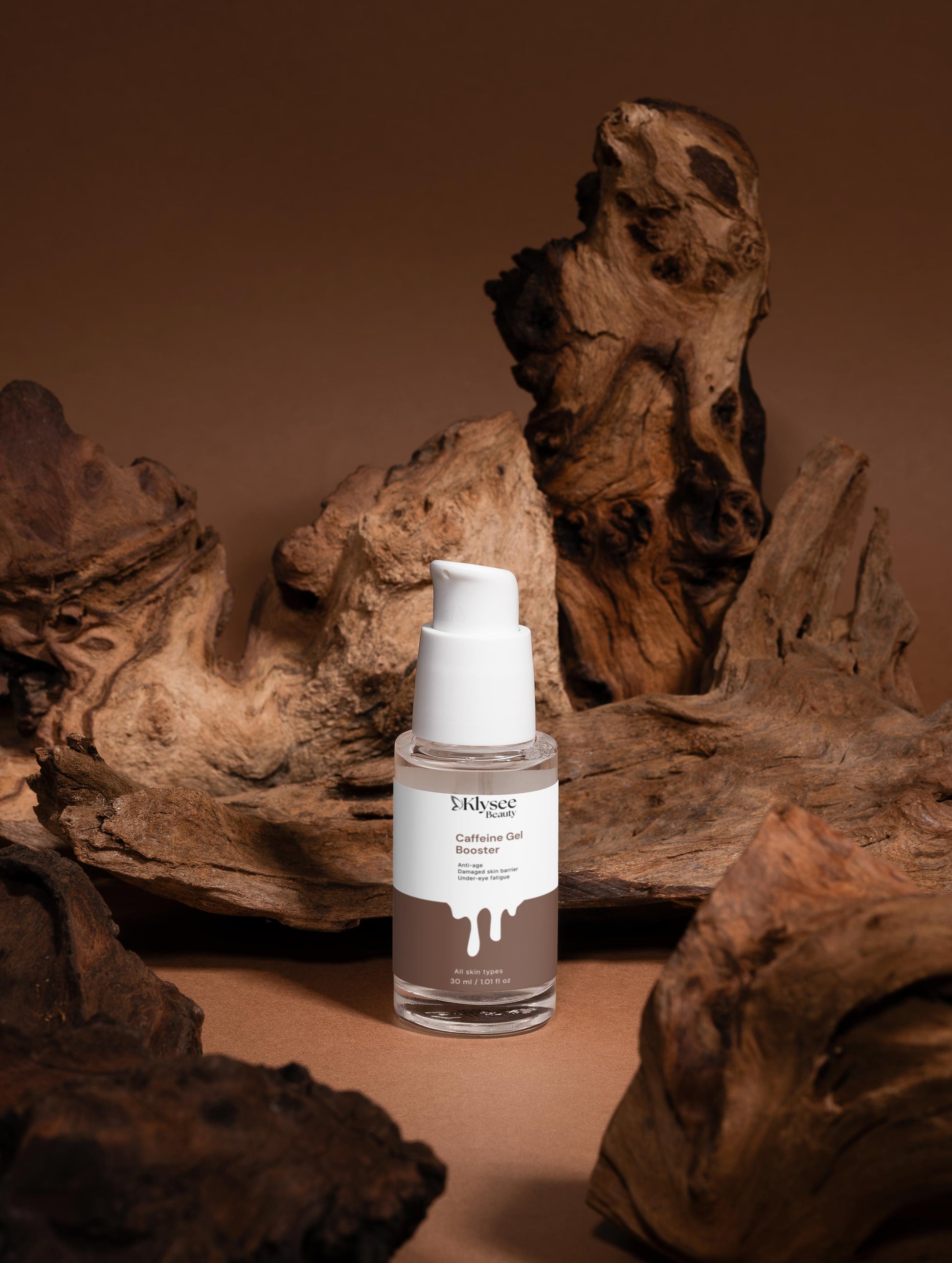 Skincare bottle with a white cap on a brown background with natural wood elements