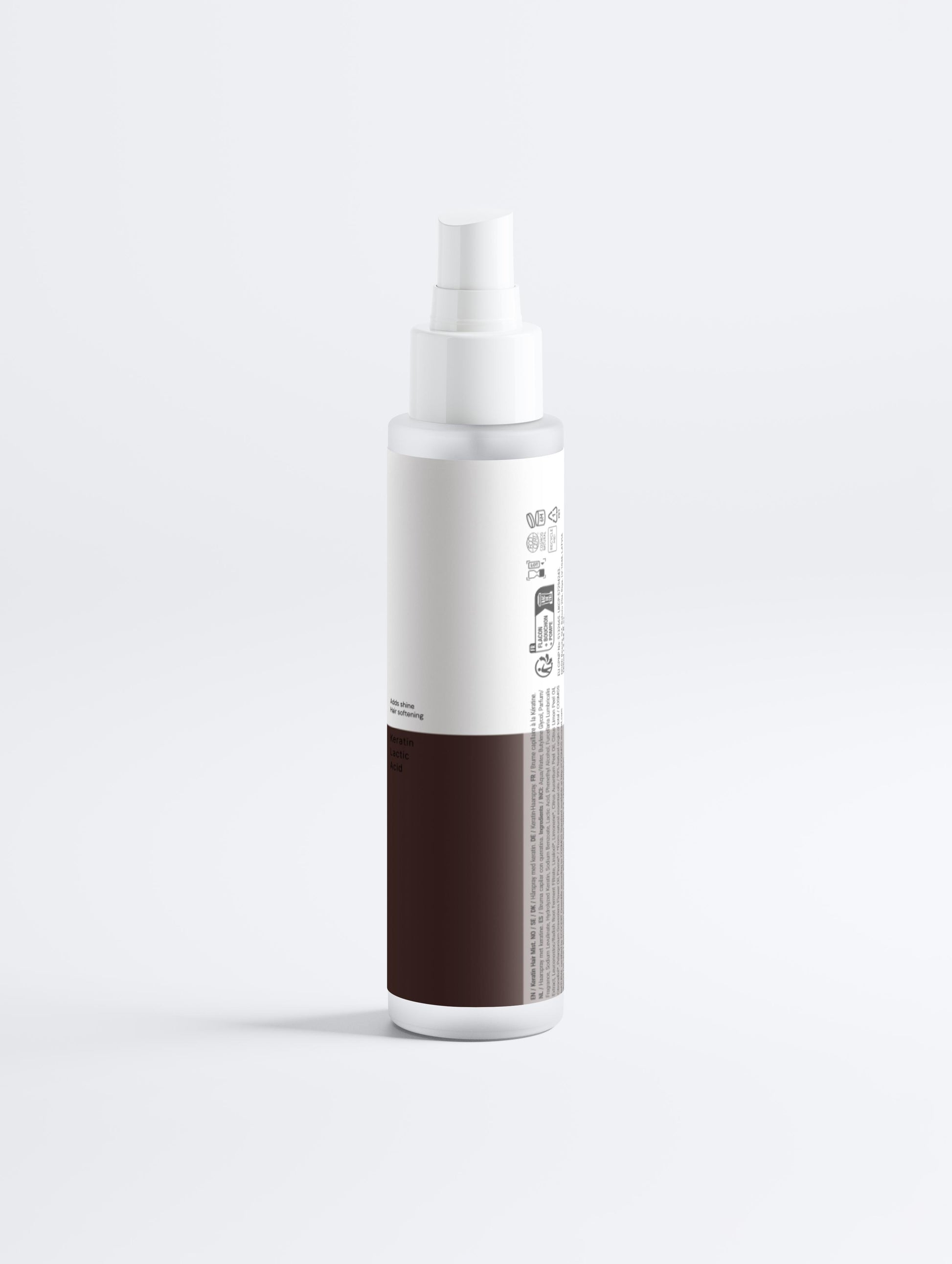 White spray bottle with a brown label on a light gray background