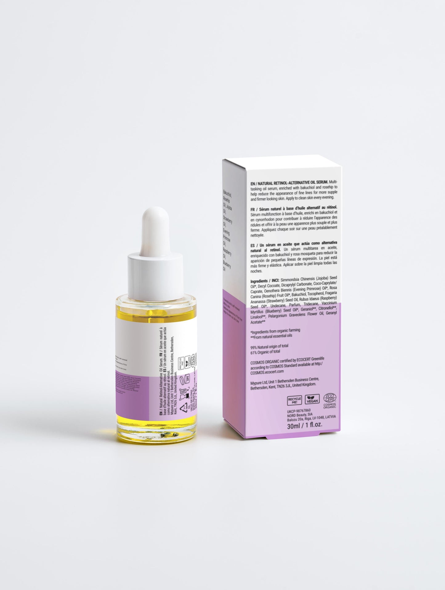 Skincare serum bottle with dropper and packaging on a white background