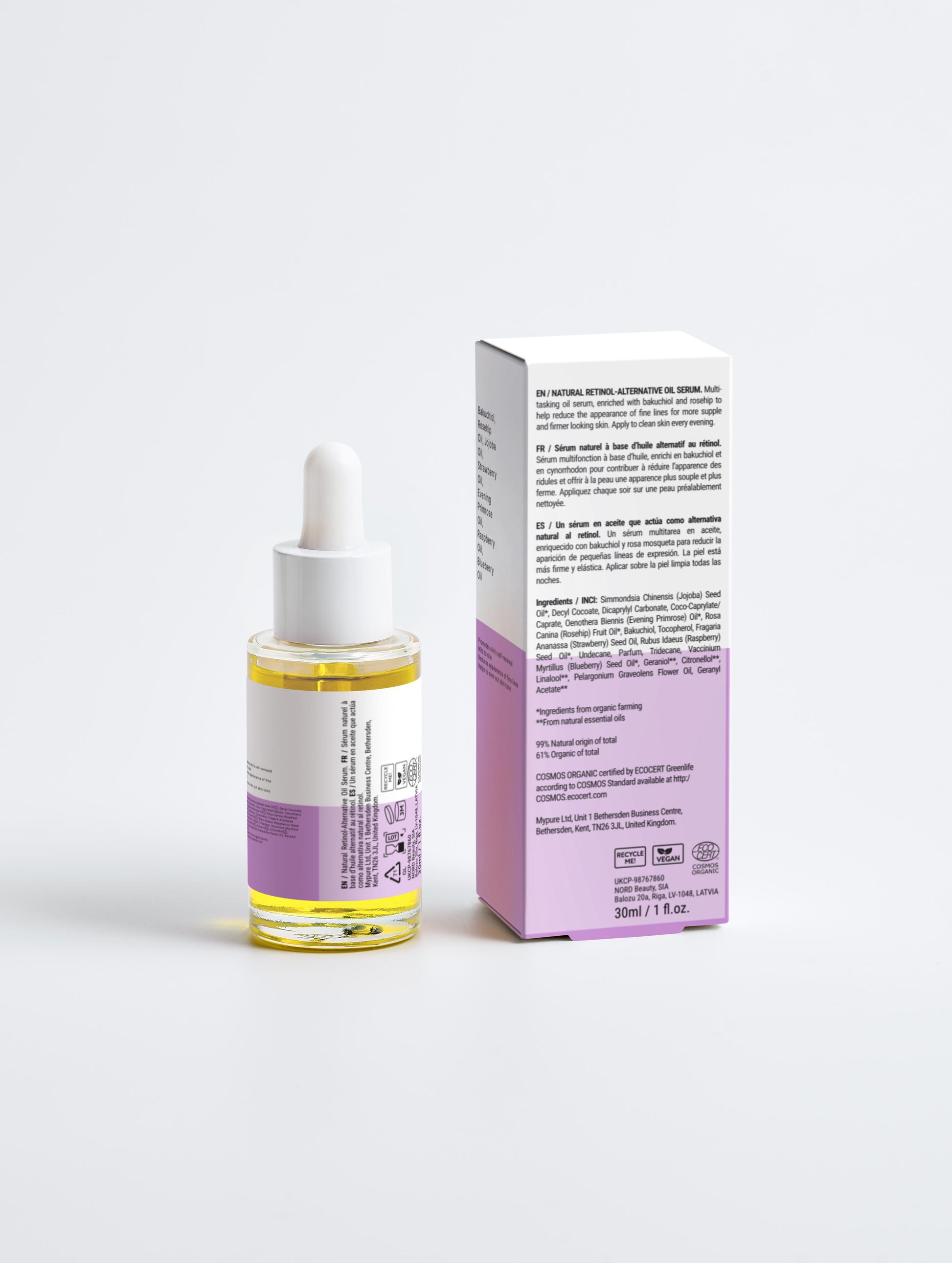 Skincare serum bottle with dropper and packaging on a white background