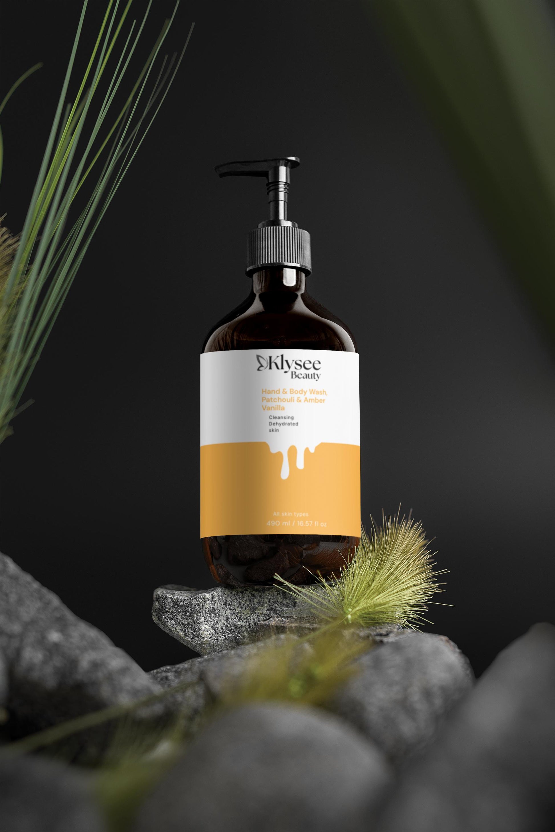 Bottle of Klysee Beauty product on a dark background with greenery