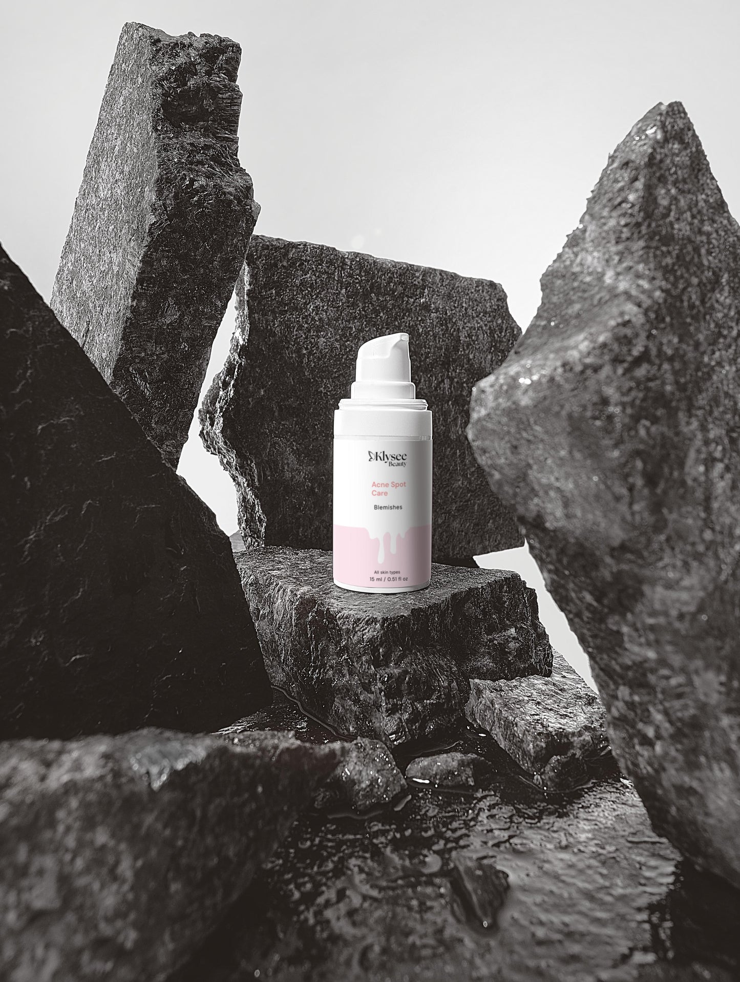 Skincare bottle on a stone surface with a minimal background