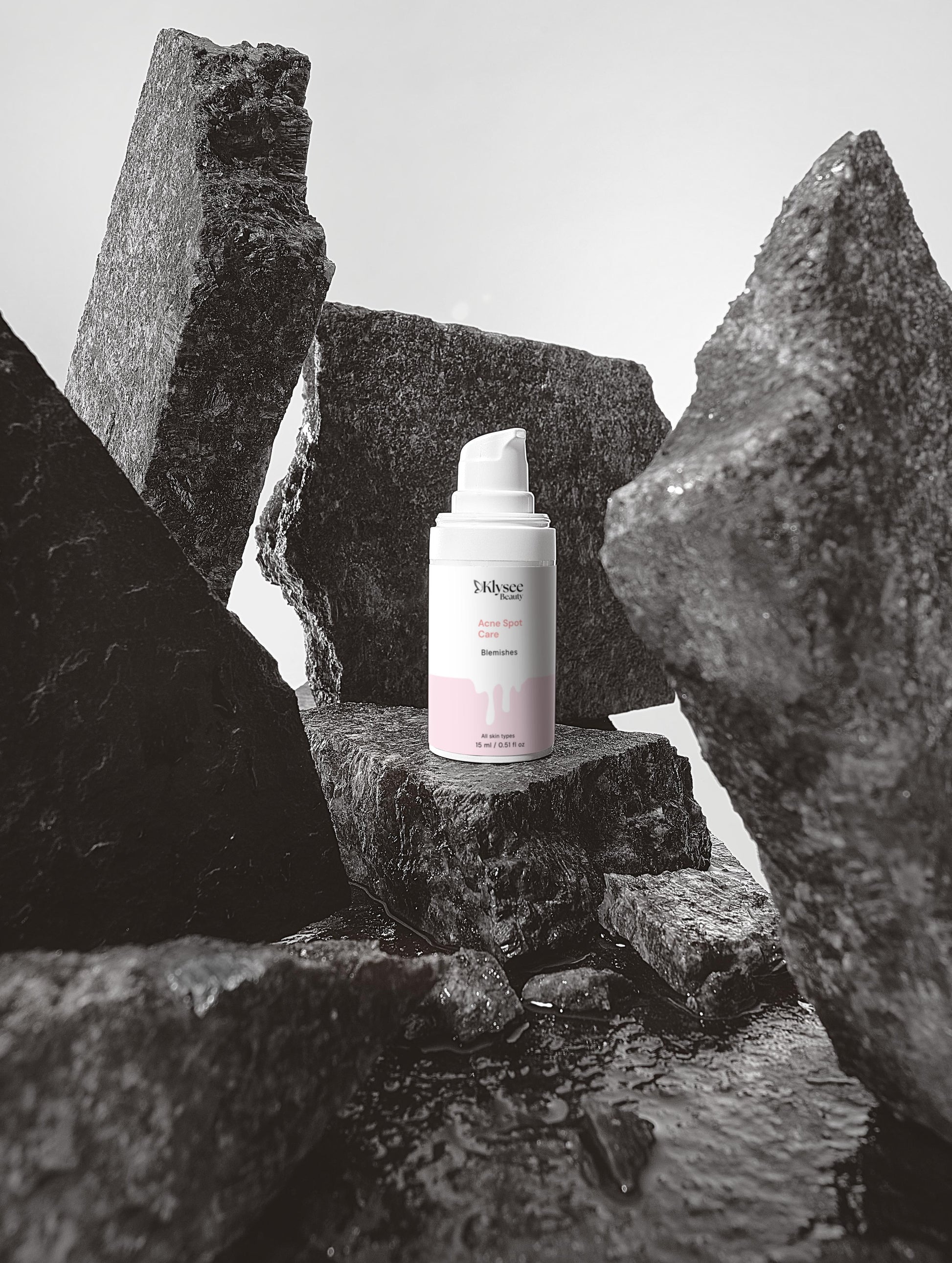 Skincare bottle on a stone surface with a minimal background