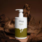 Klysee Beauty shampoo bottle with pump on a brown background