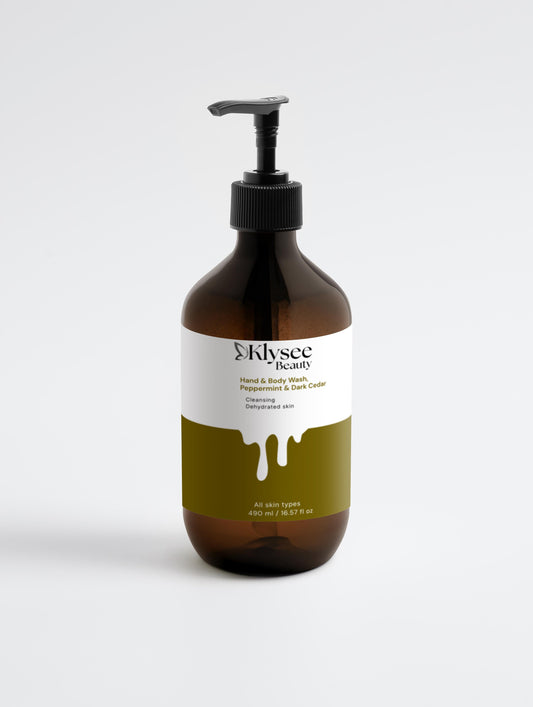 A large 490ml bottle of Klysee Cooling Peppermint & Dark Cedar Hand & Body Wash, featuring its elegant amber-toned packaging.