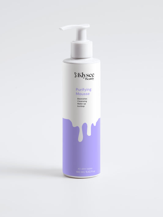 Klysee Purifying Mousse bottle with purple and white design on a light gray background