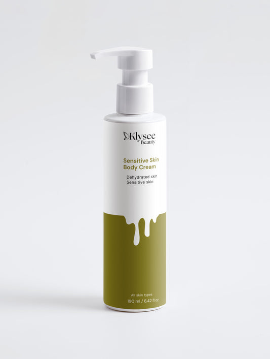 Body cream bottle with green and white design on a light gray background