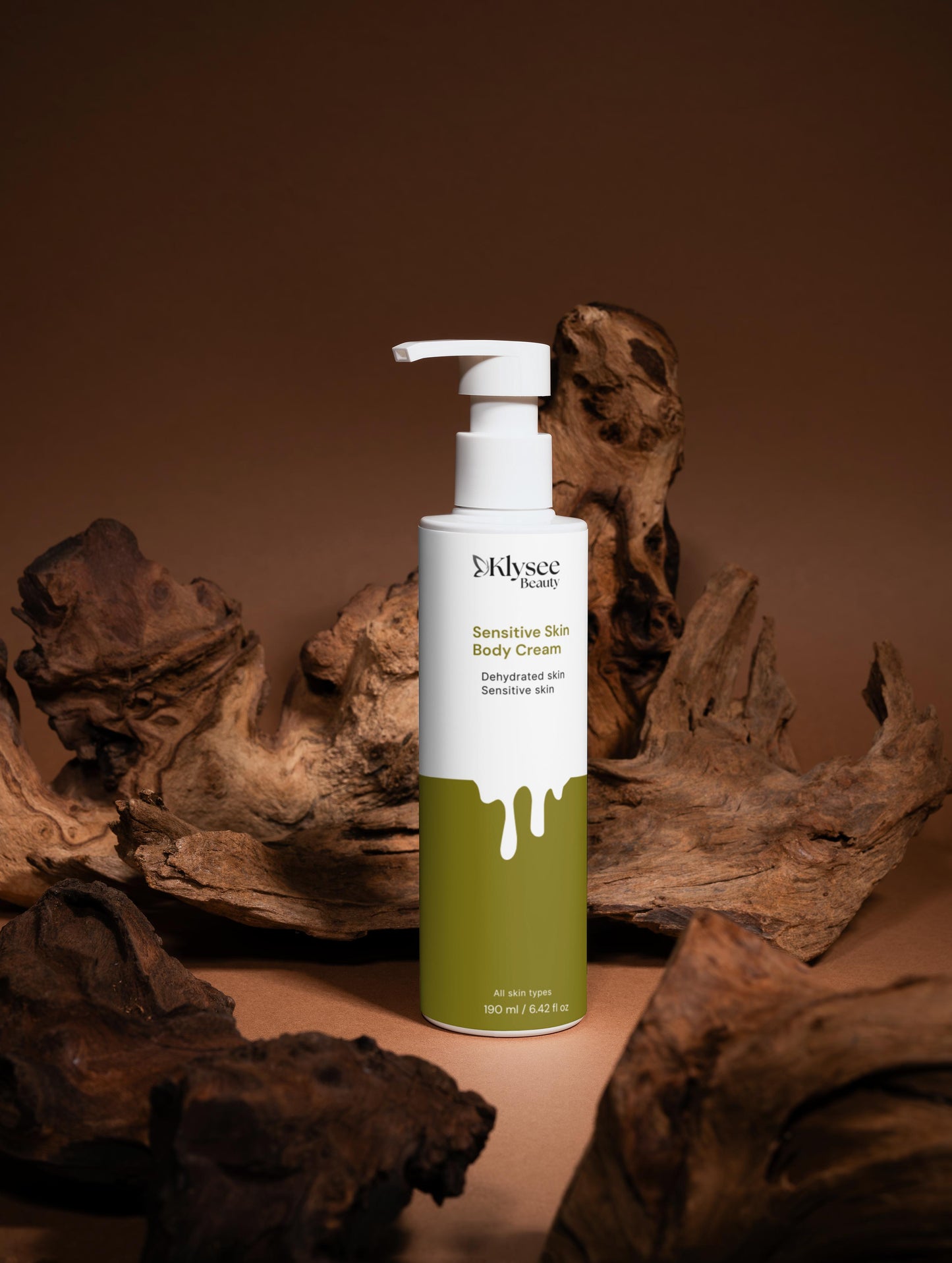 Skincare bottle with pump on a brown background