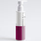 White and purple bottle with pump on a light gray background