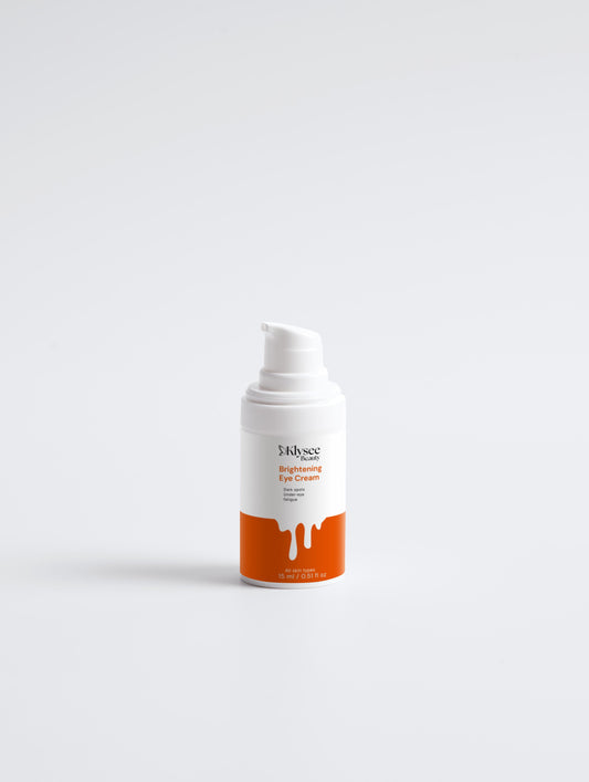 Skincare cream bottle with orange label on a white background